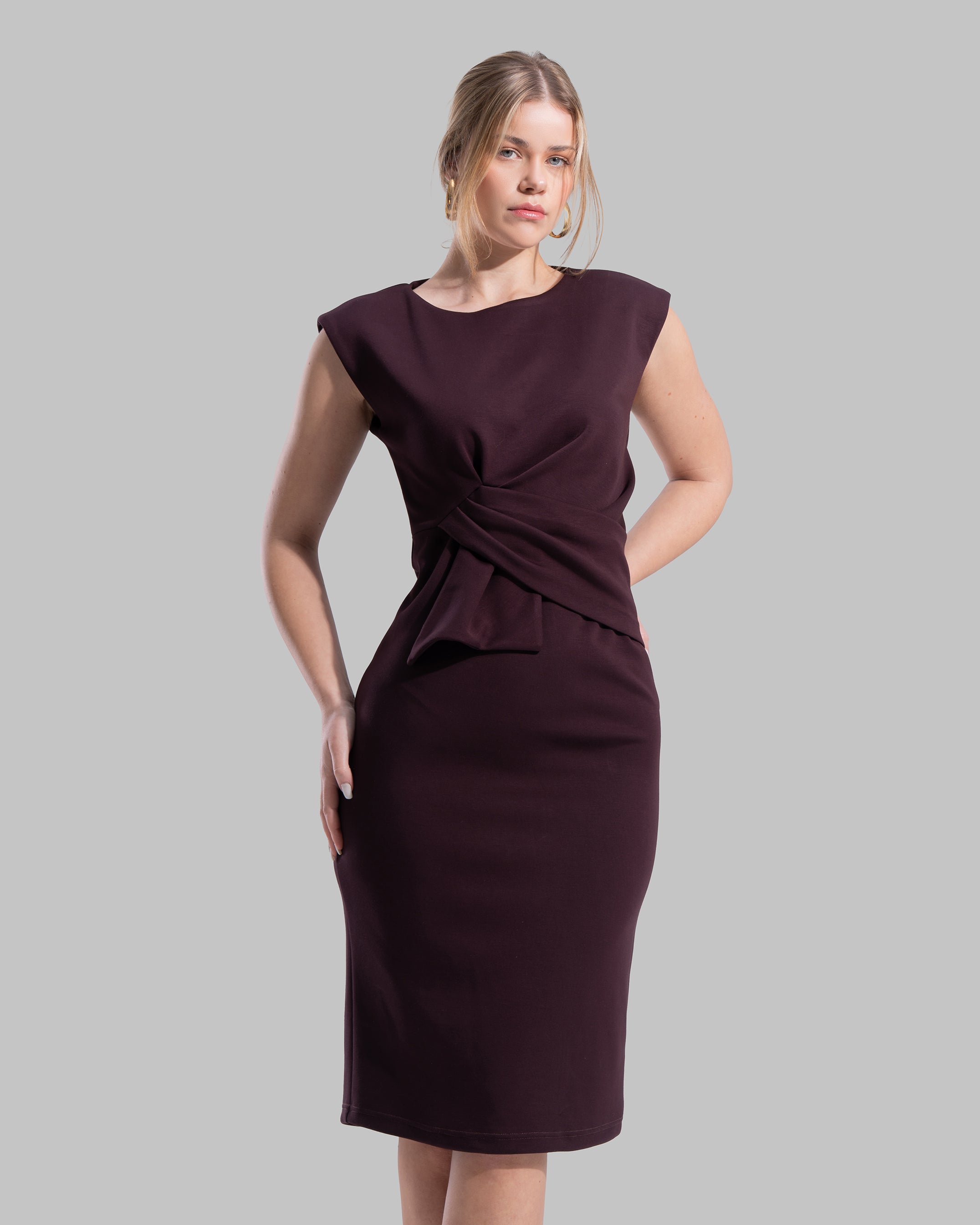 Sleeveless midi dress featuring a round neckline and front draped knot detail.