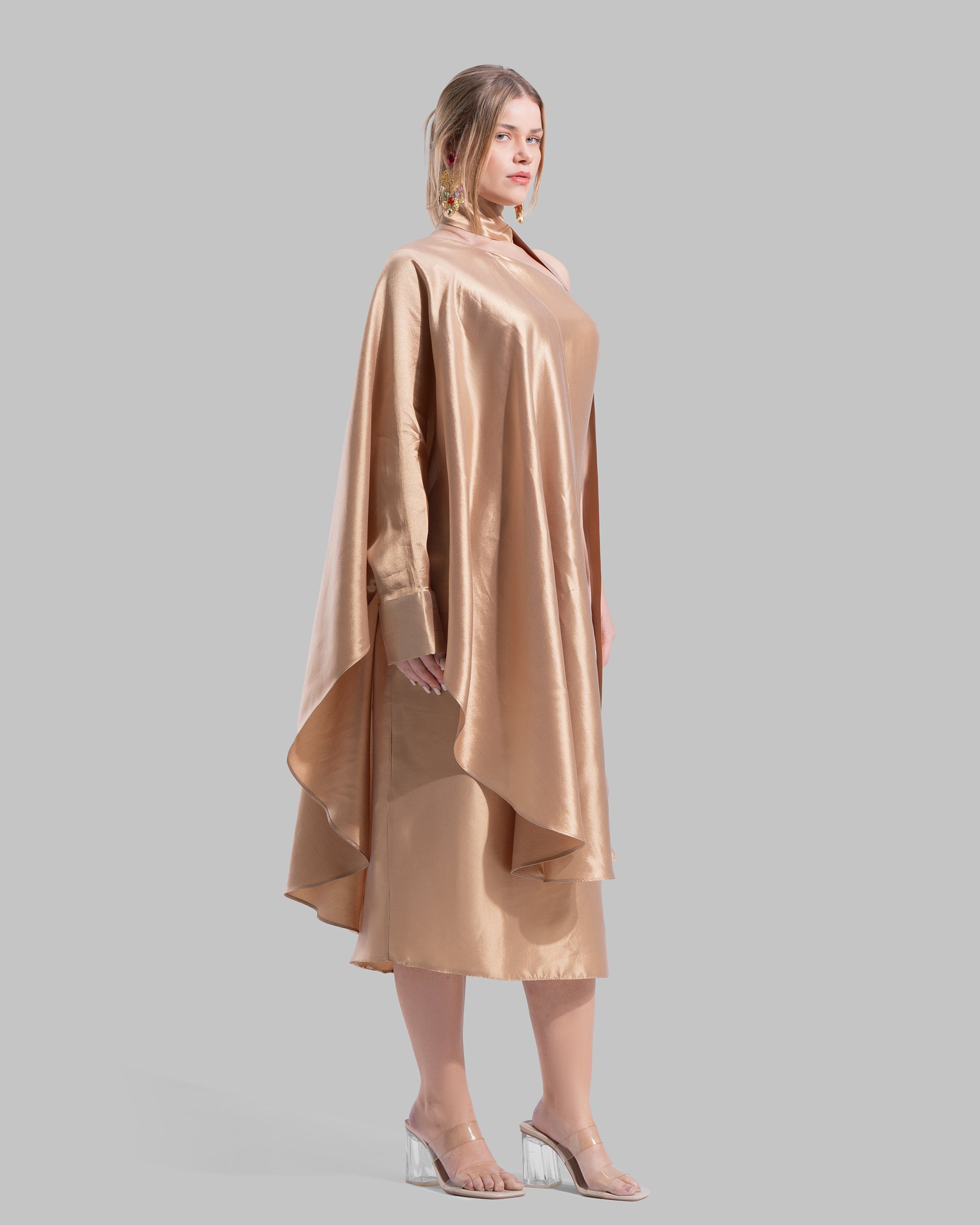 One-shoulder satin midi dress featuring a draped cape overlay and side slit