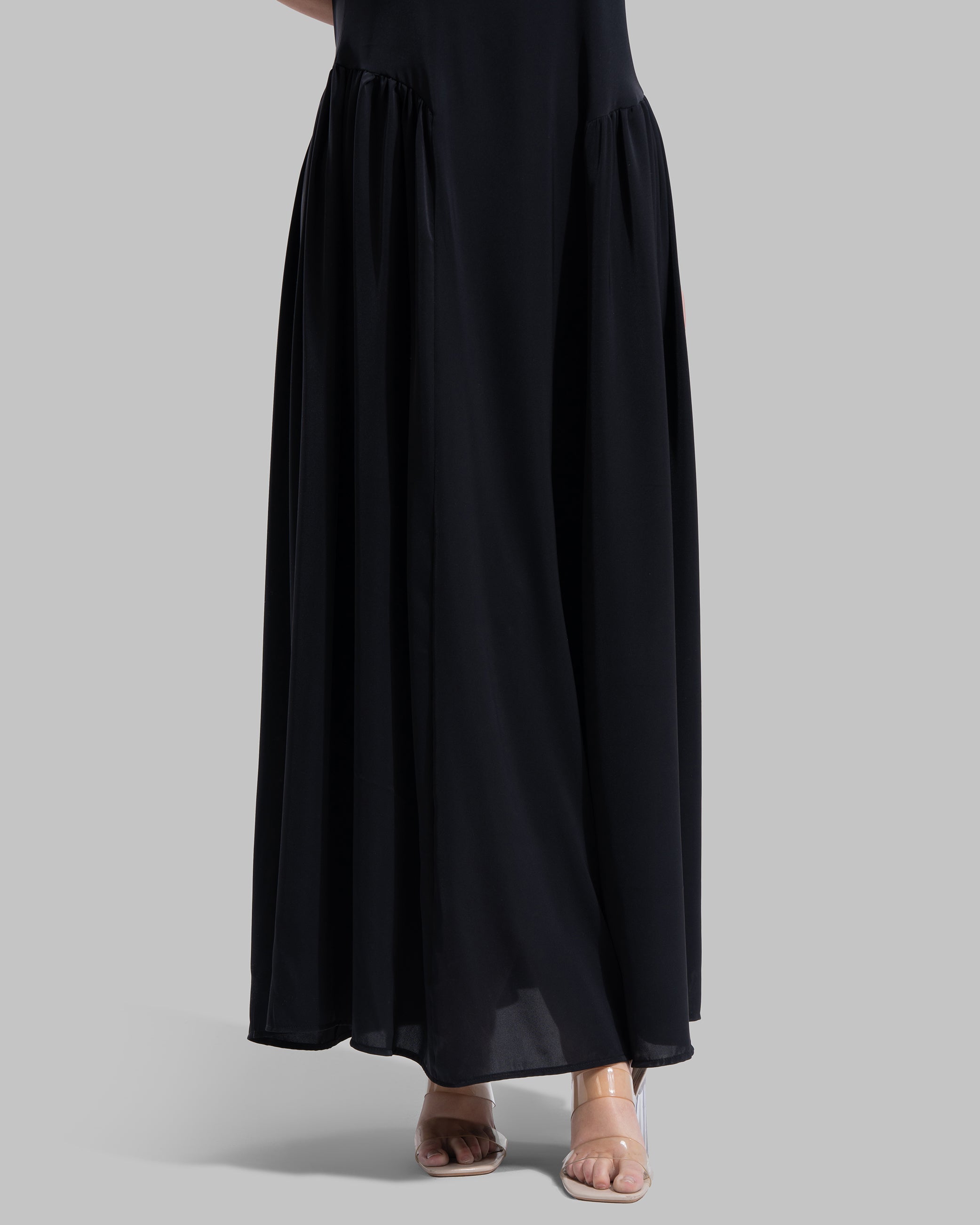 Sleeveless long dress with a round neckline.