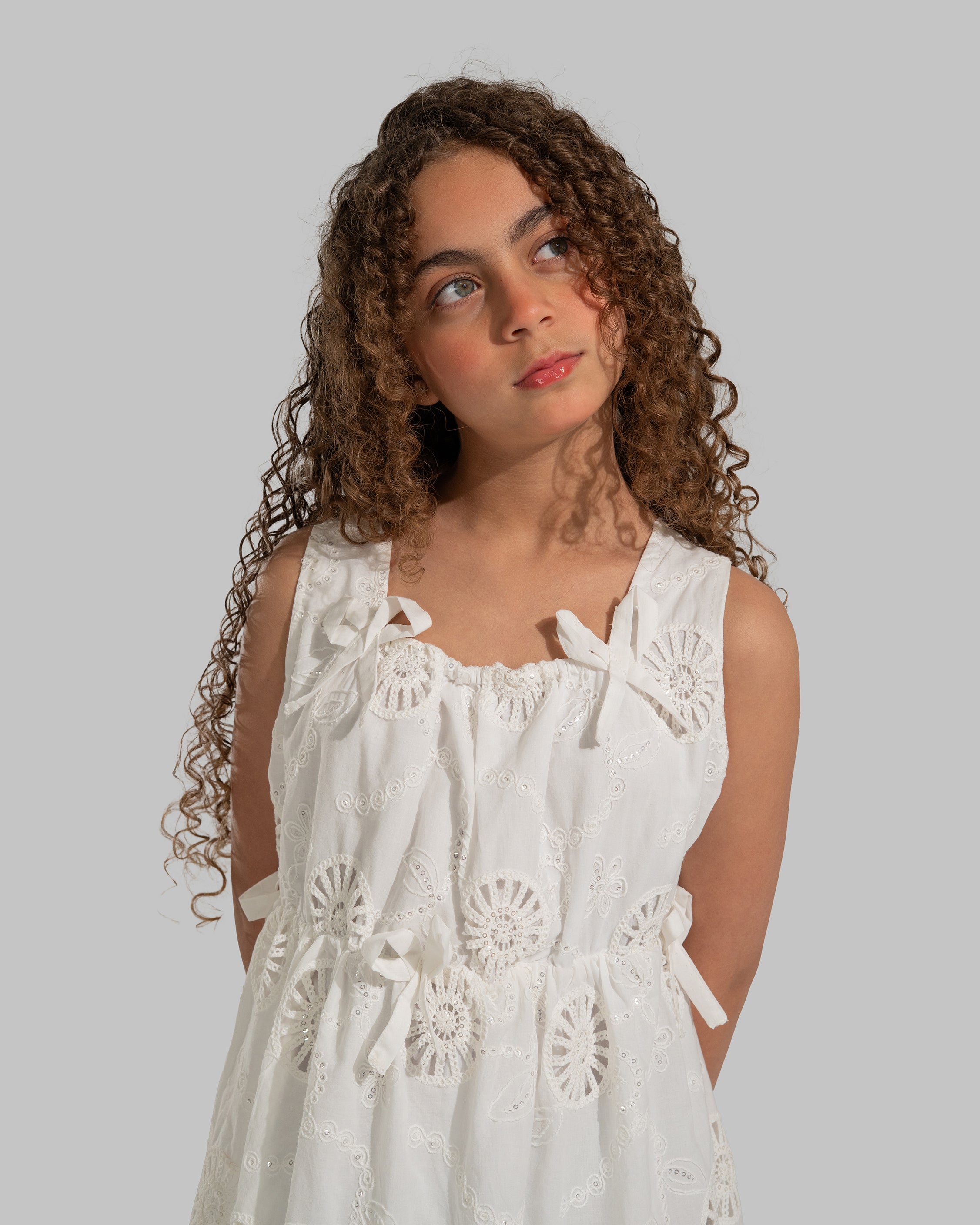 White eyelet midi dress with delicate bow details