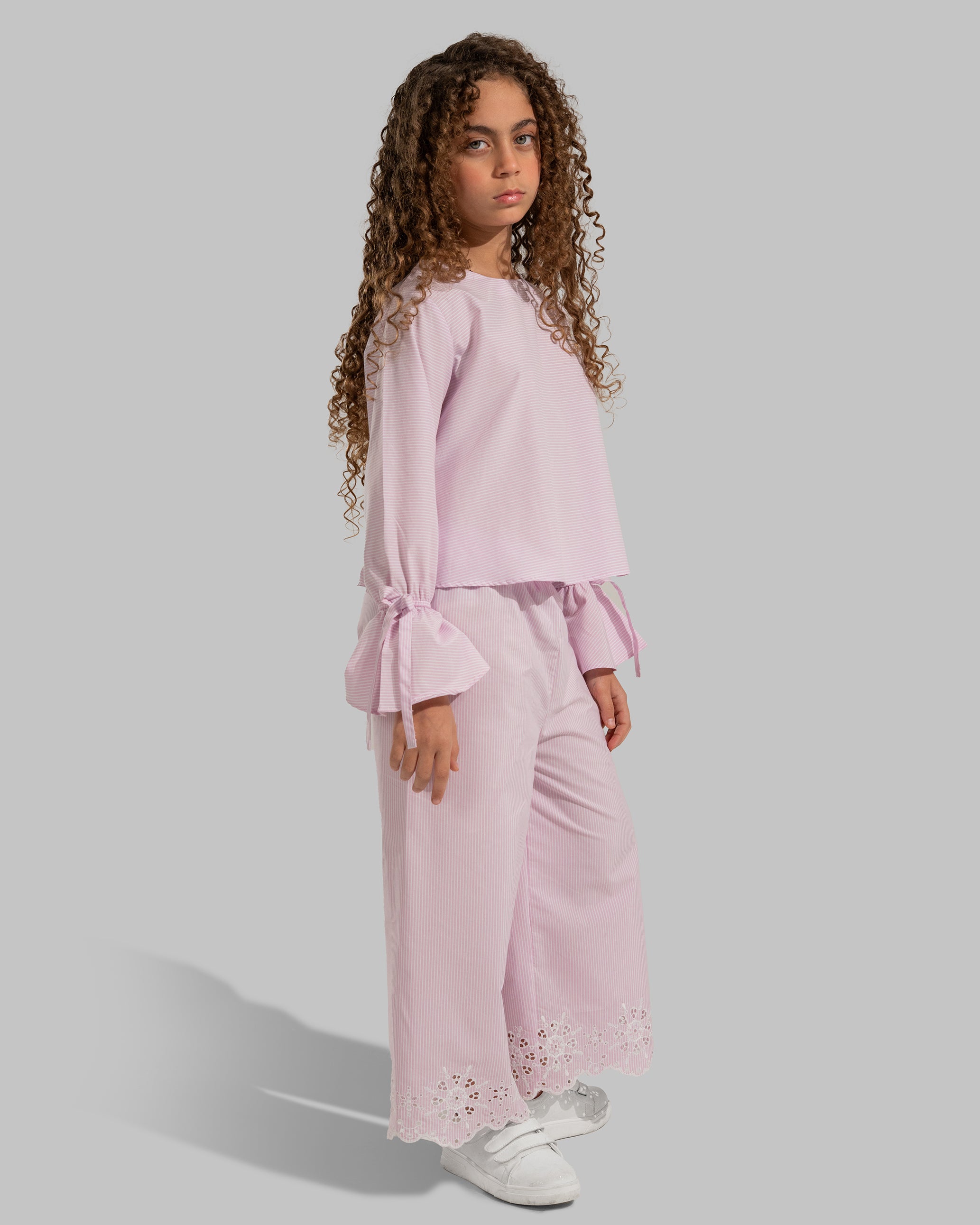 Striped cropped top with bow-detail flare sleeves.