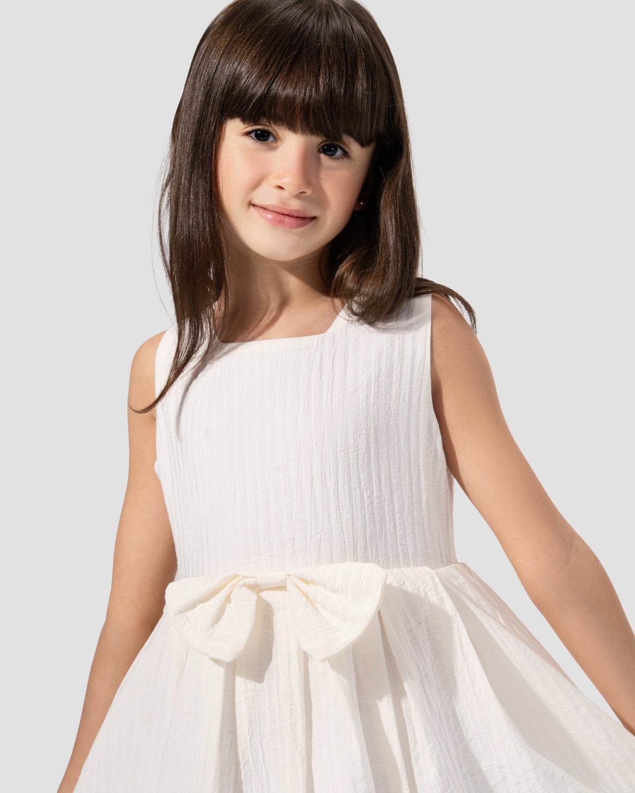 Textured sleeveless dress with a round neckline and a flared skirt