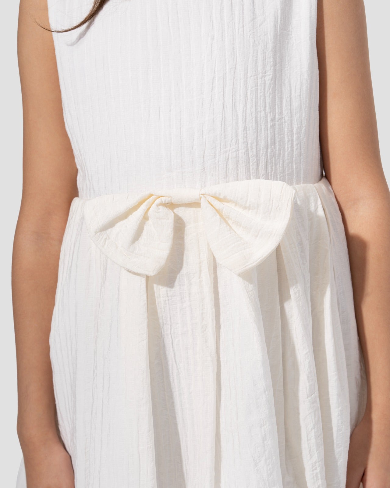 Textured sleeveless dress with a round neckline and a flared skirt
