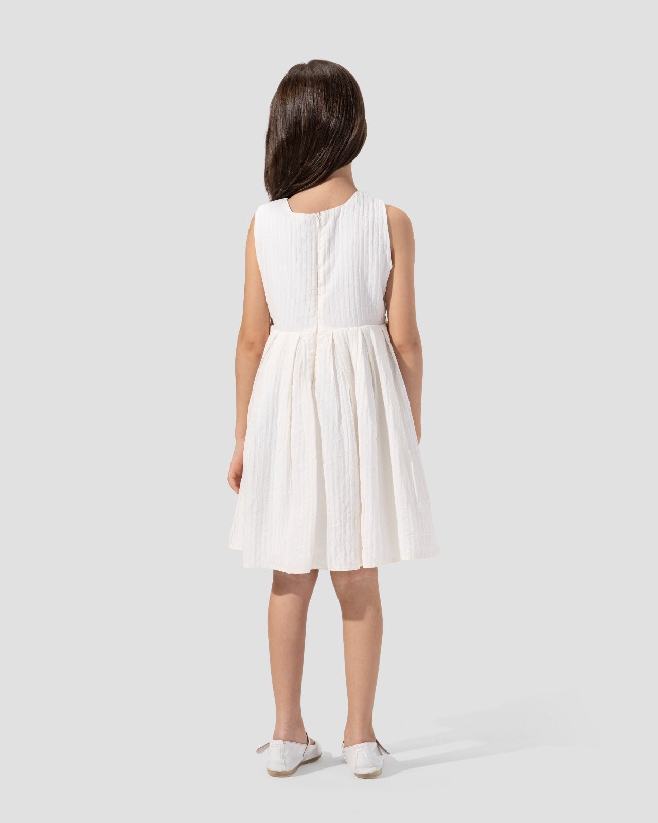 Textured sleeveless dress with a round neckline and a flared skirt