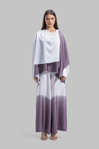 Draped asymmetrical blouse with a side-split design.