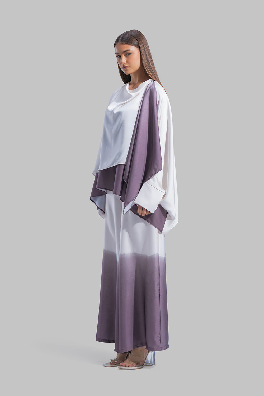 Draped asymmetrical blouse with a side-split design.