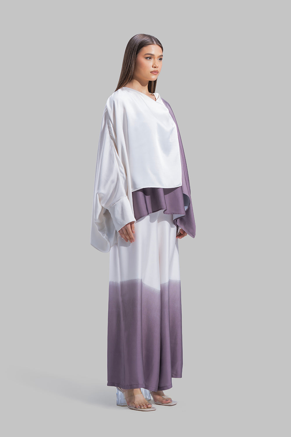 Draped asymmetrical blouse with a side-split design.