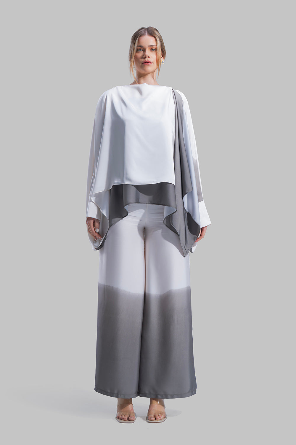 Draped asymmetrical blouse with a side-split design.