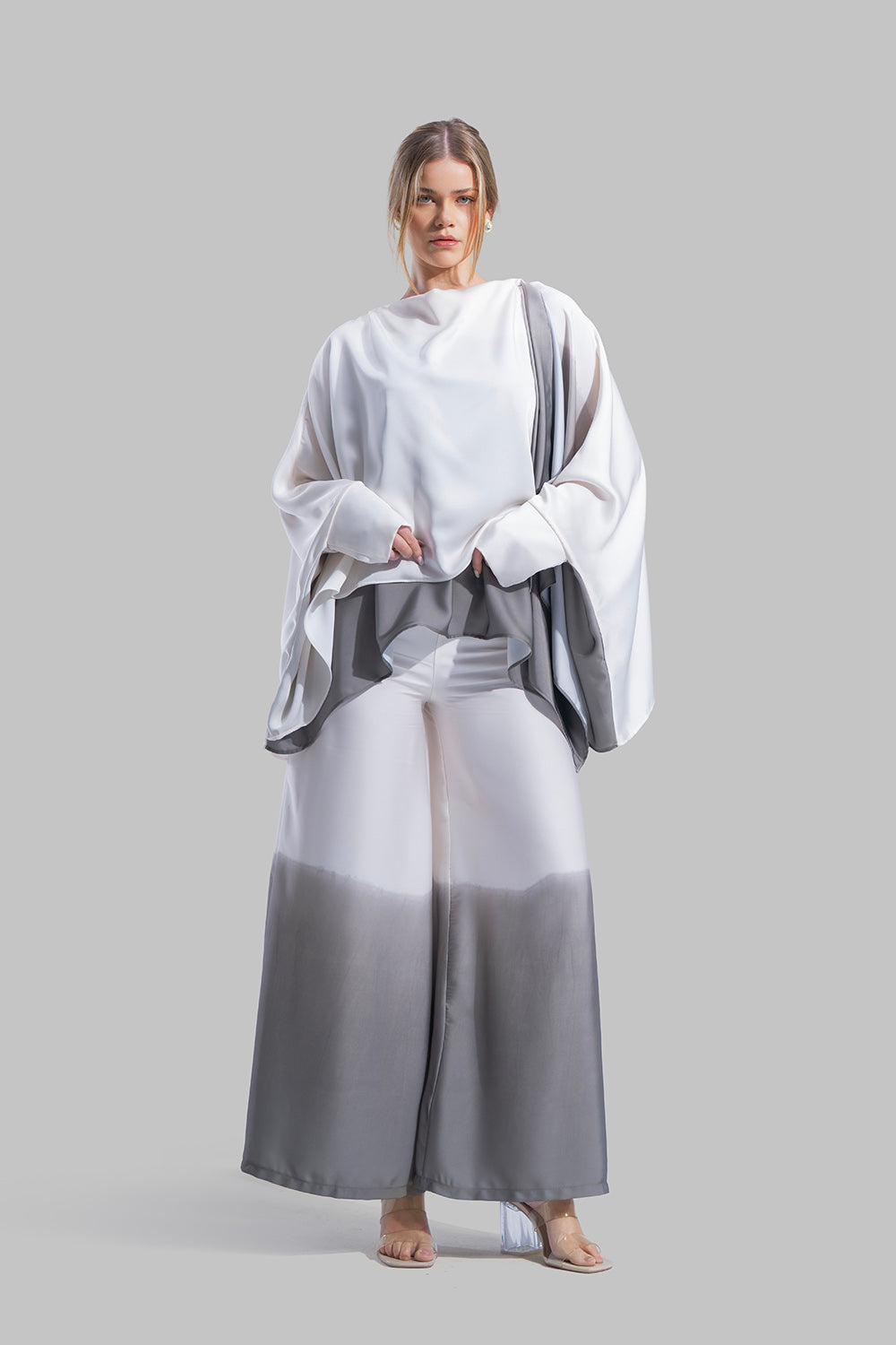 Draped asymmetrical blouse with a side-split design.