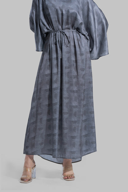 Oversized maxi dress featuring a V-neckline and wide kimono-style sleeves.