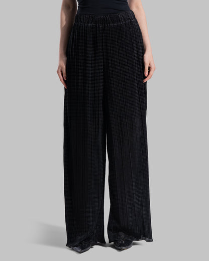 High-waisted wide-leg trousers with an elastic waistband and a textured plissé fabric.