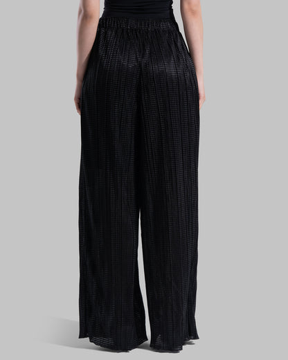 High-waisted wide-leg trousers with an elastic waistband and a textured plissé fabric.