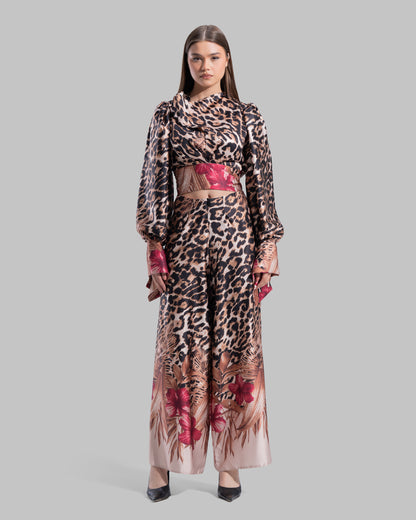 Long sleeve top with a draped neckline and slightly puffed shoulders.