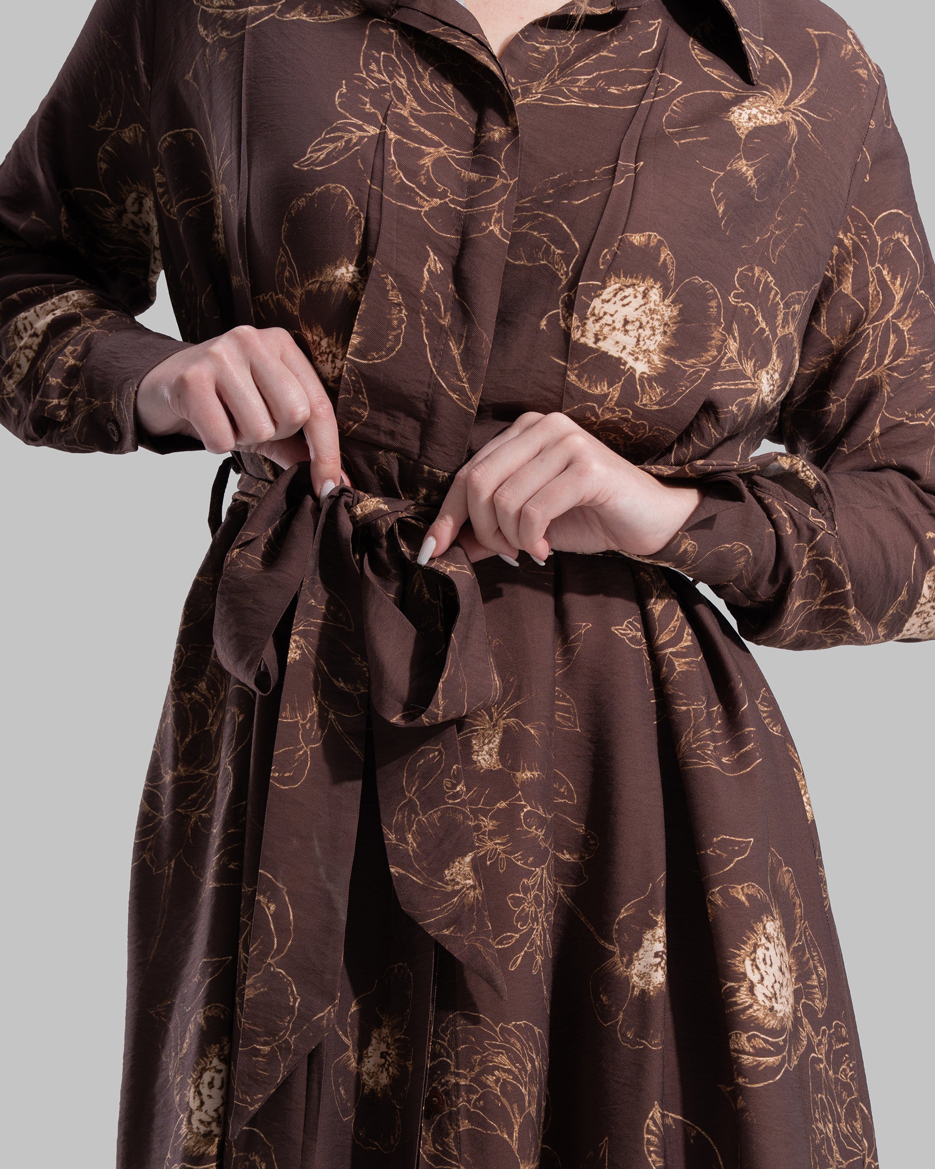 Floral print midi shirt dress with a matching tie belt at the waist.