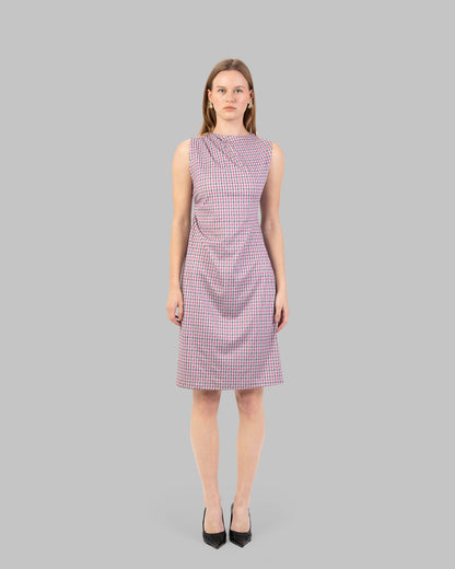 fitted dress with a pink and black houndstooth pattern.