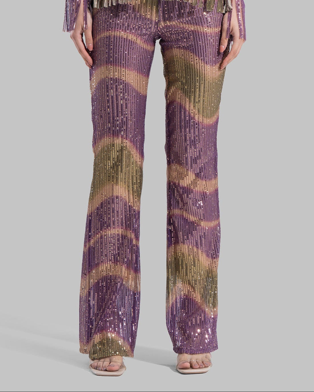 High-waisted Flared Leg trousers with an elastic waistband.