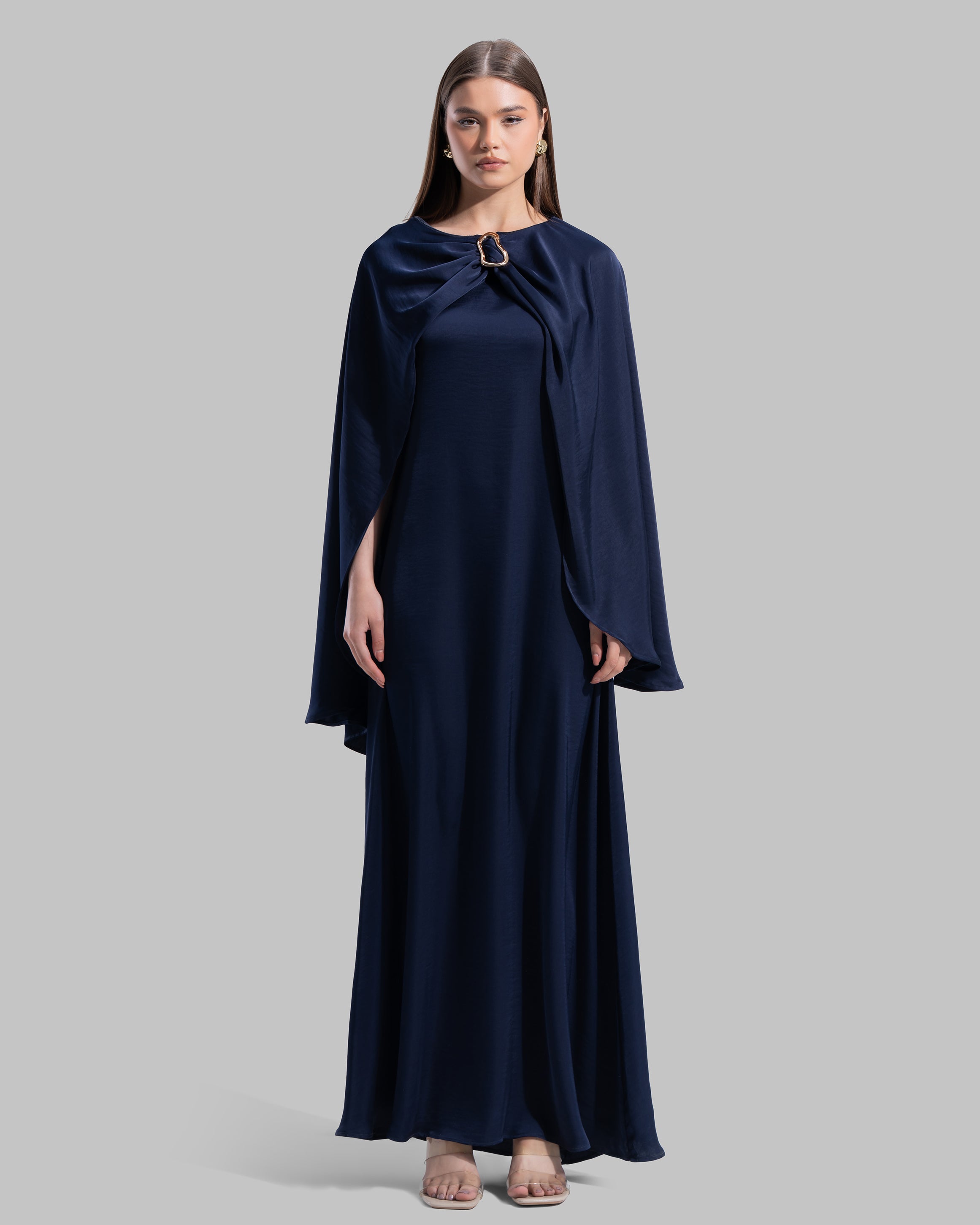 Long dress made of a flowing satin-finish fabric.