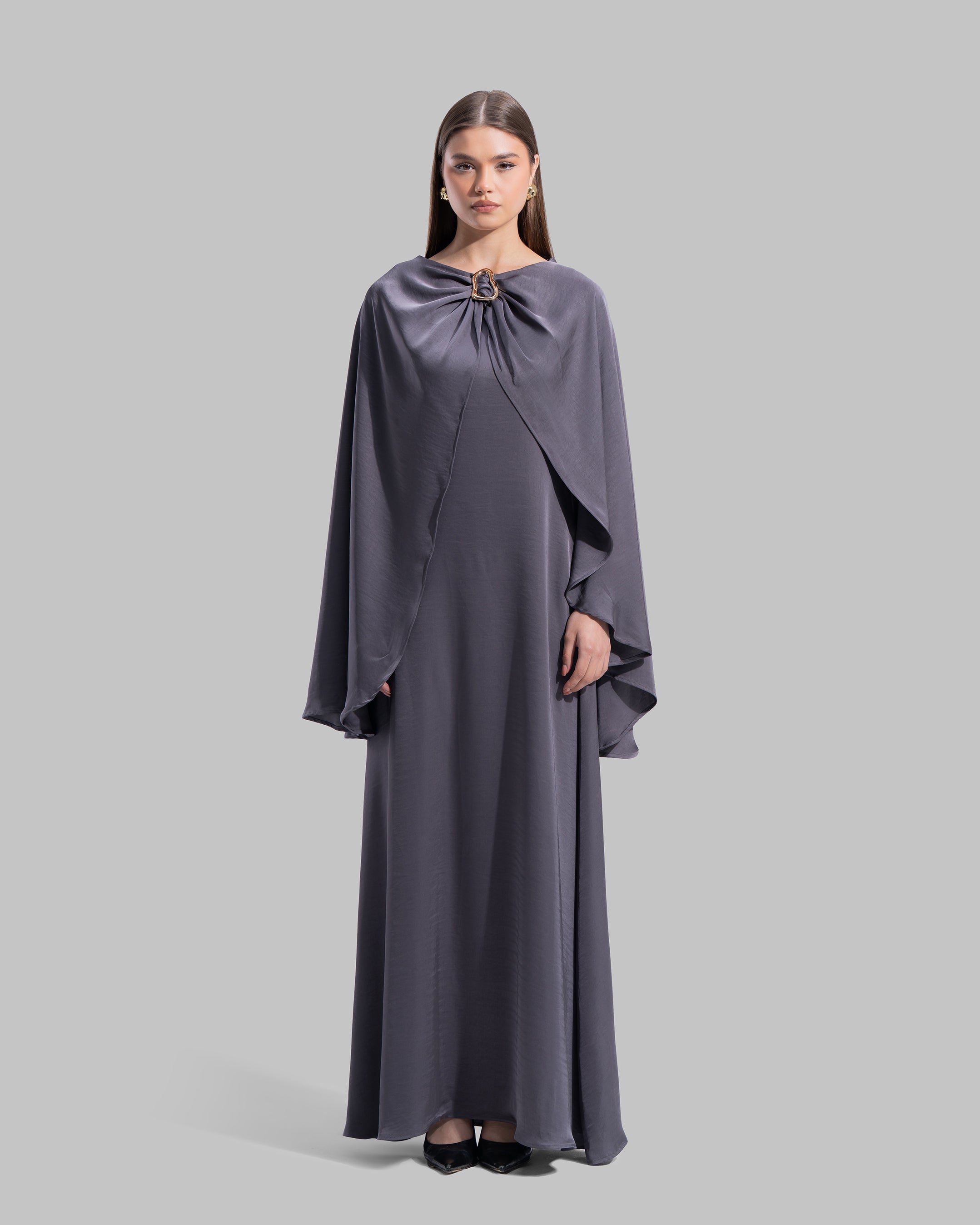Long dress made of a flowing satin-finish fabric.
