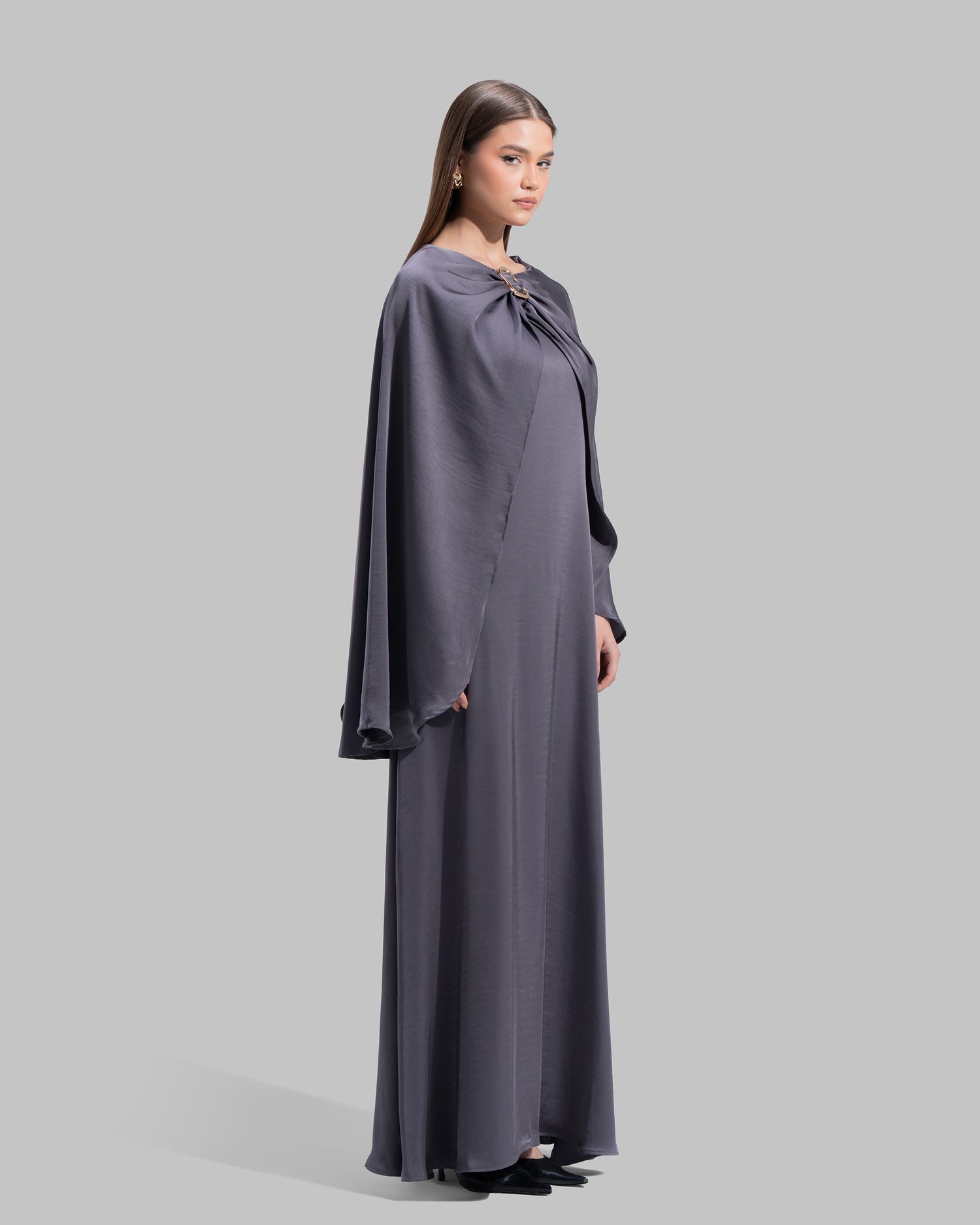 Long dress made of a flowing satin-finish fabric.