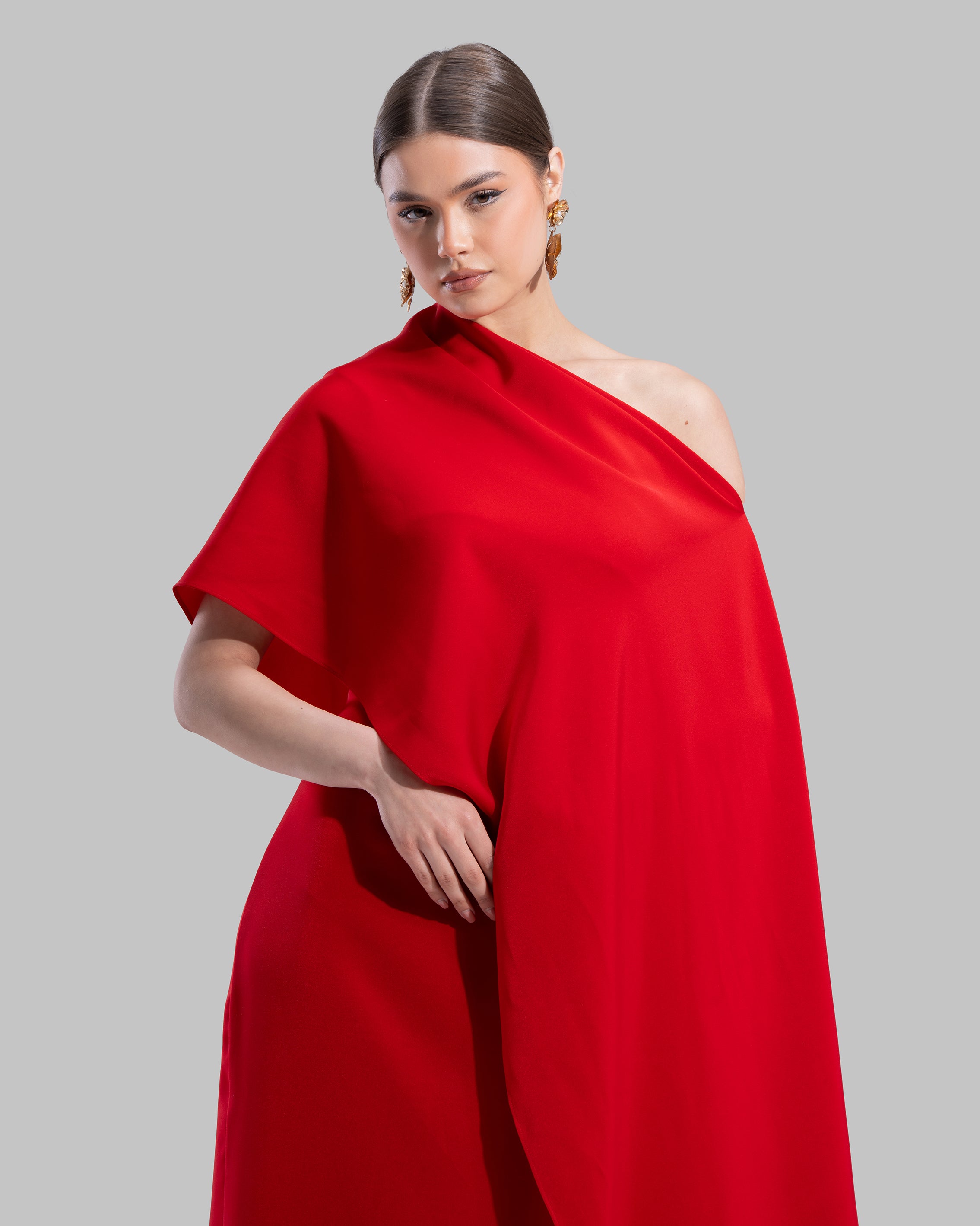 Draped asymmetrical neckline satin maxi dress with a fluid oversized silhouette.