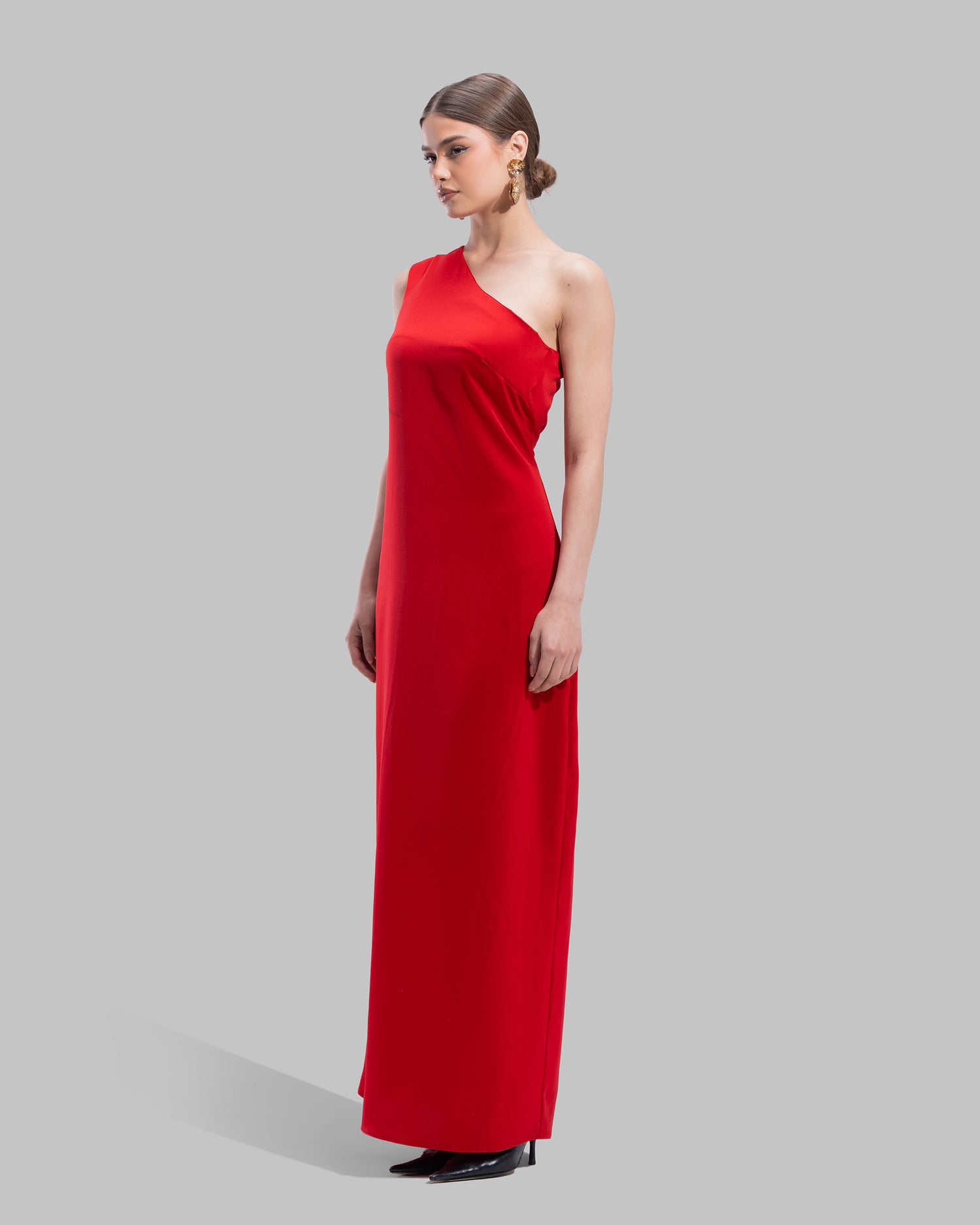 Draped asymmetrical neckline satin maxi dress with a fluid oversized silhouette.