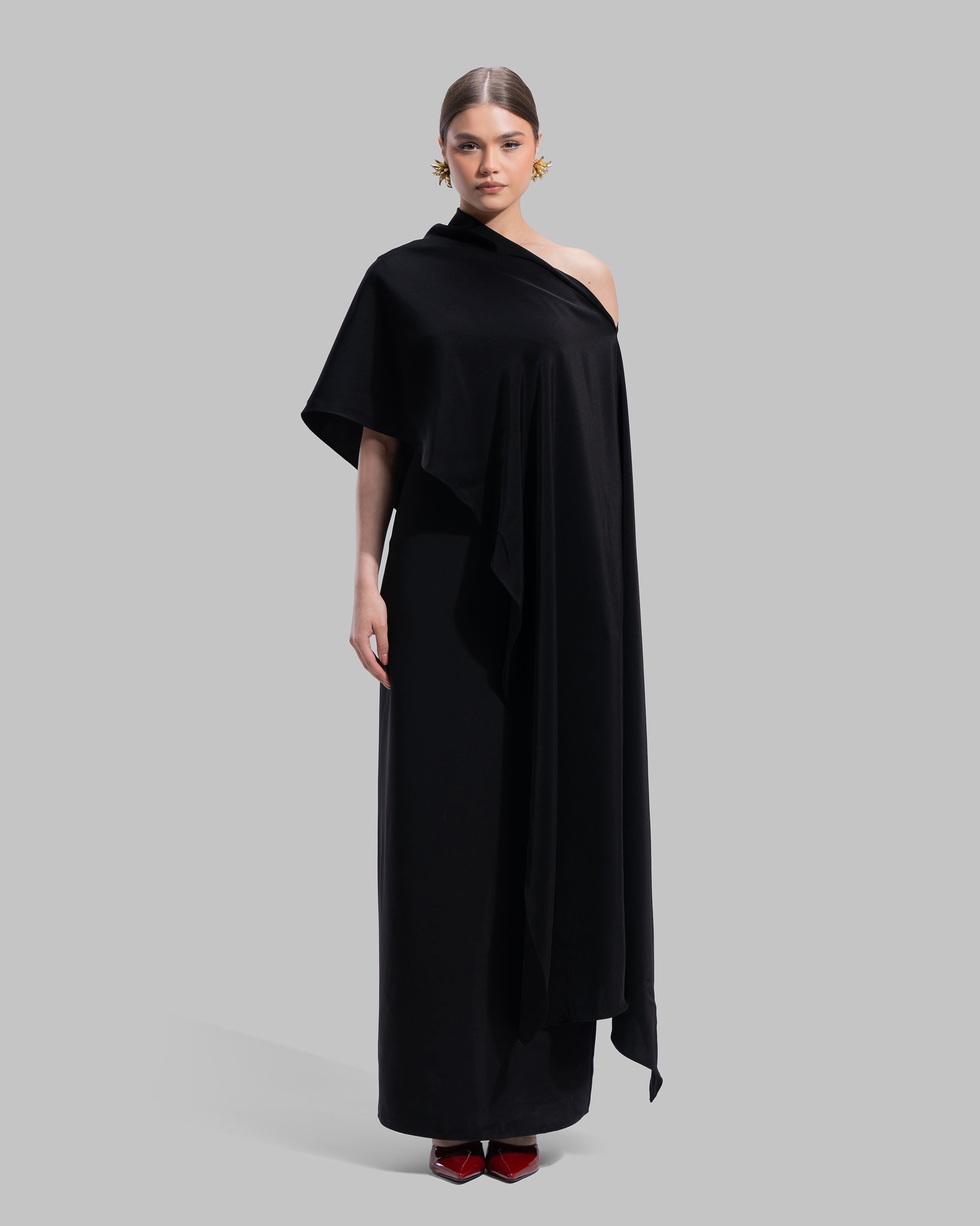 Draped asymmetrical neckline satin maxi dress with a fluid oversized silhouette.