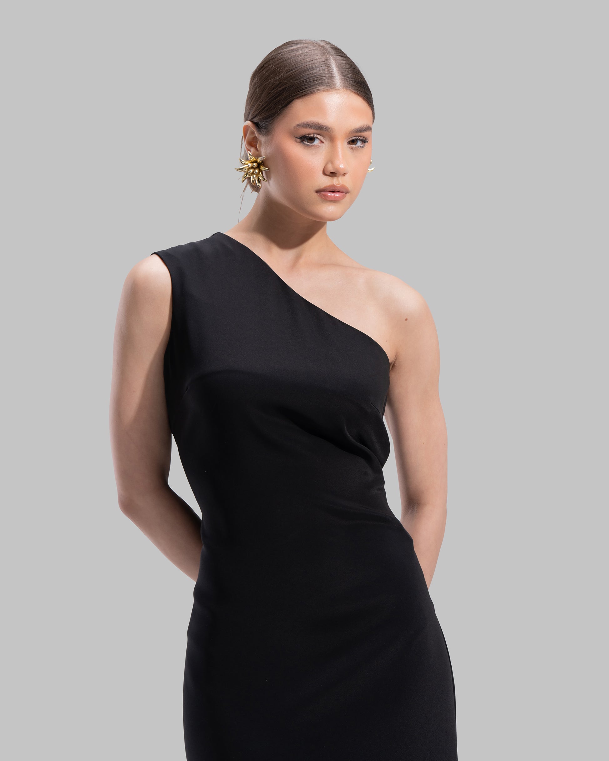 Draped asymmetrical neckline satin maxi dress with a fluid oversized silhouette.