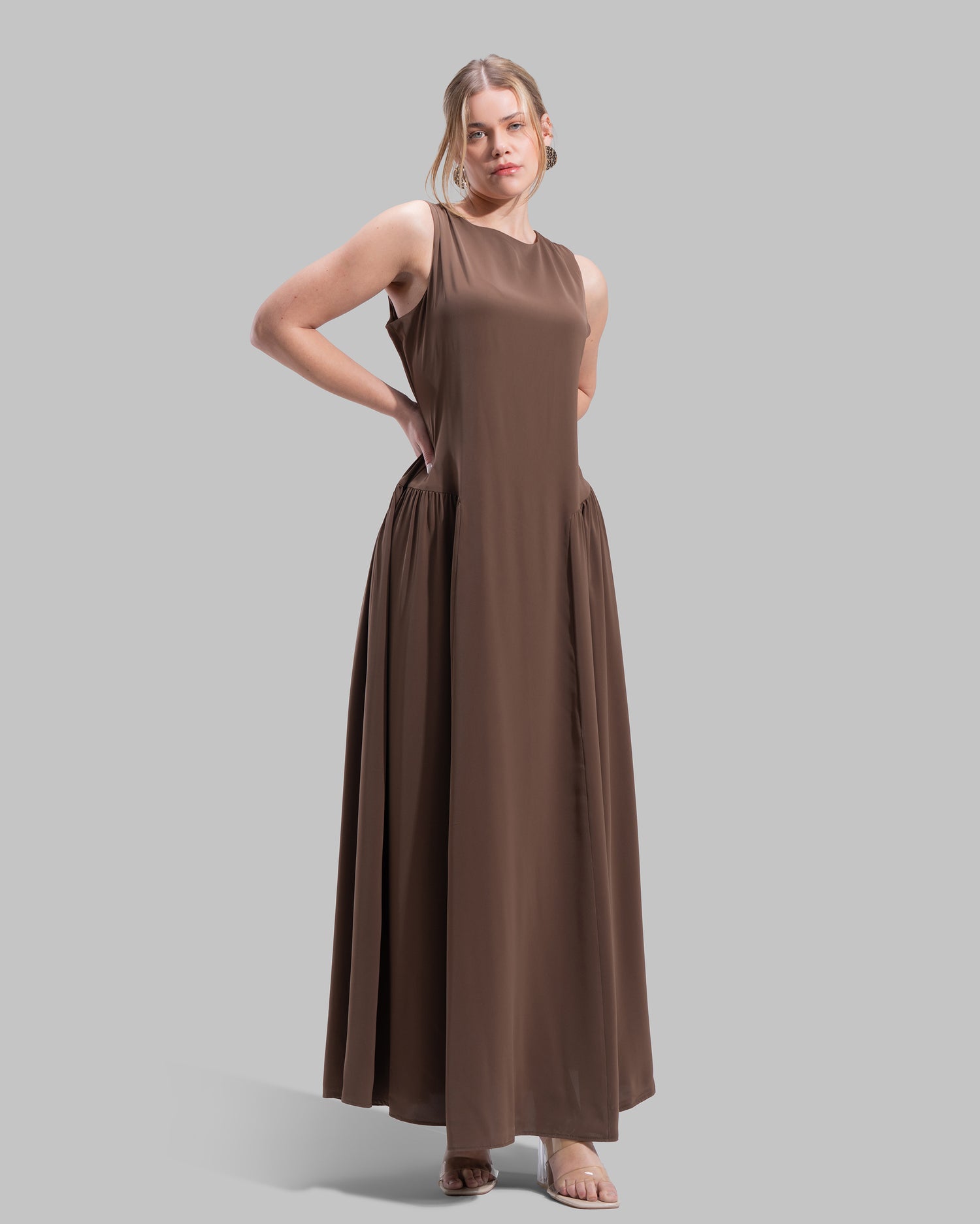 Sleeveless long dress with a round neckline.