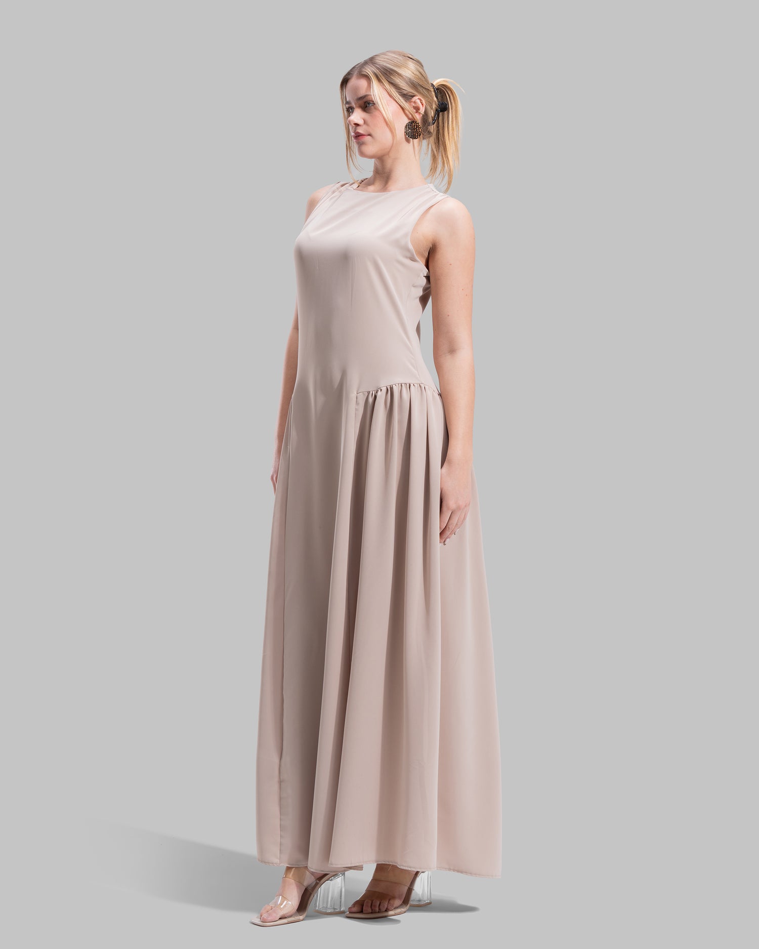 Sleeveless long dress with a round neckline.