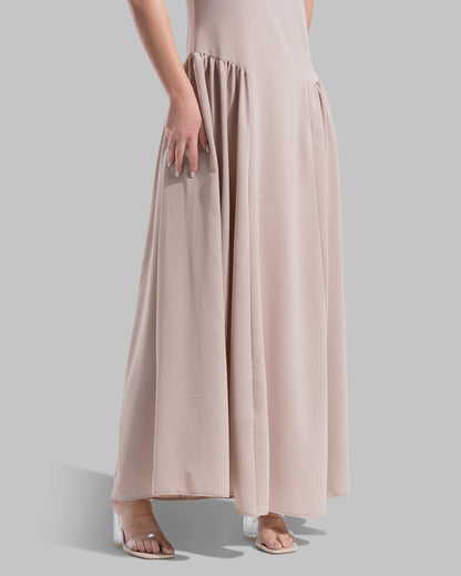 Sleeveless long dress with a round neckline.