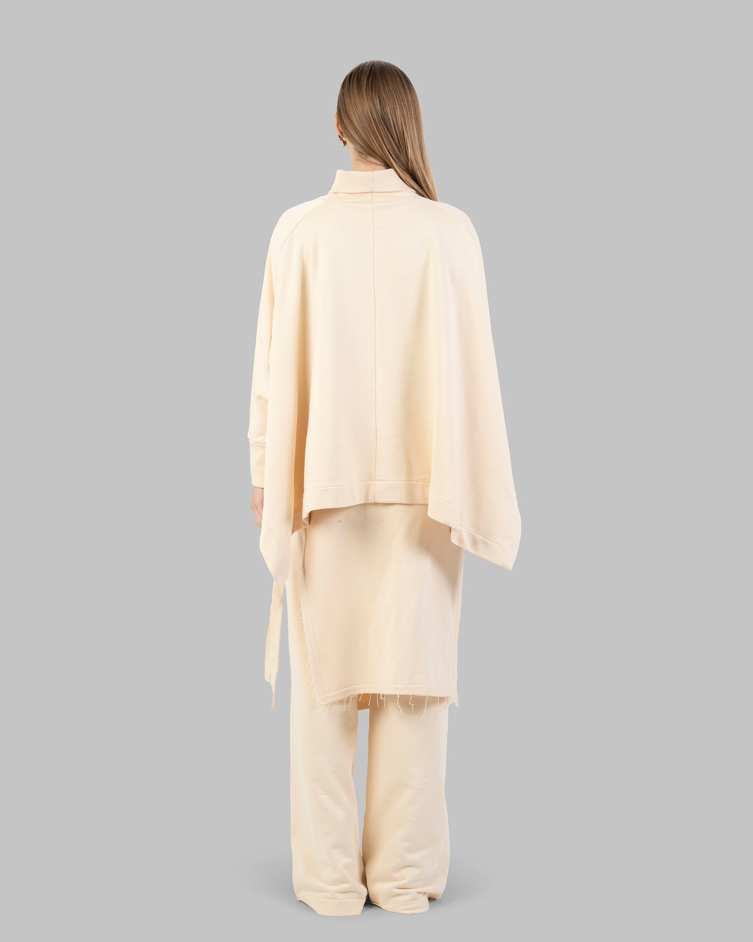 Wide-leg pants with an attached wrap-over skirt panel.