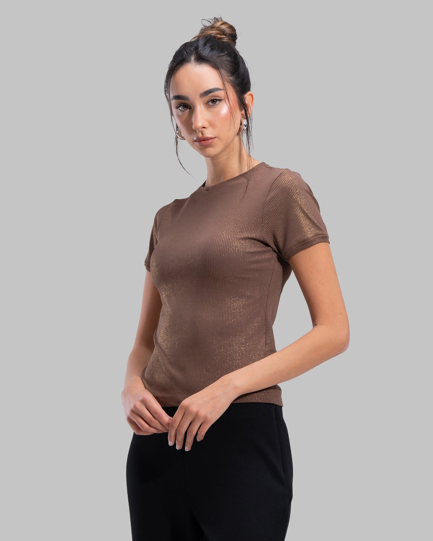 Short sleeve ribbed top with a shimmering metallic finish and round neck.