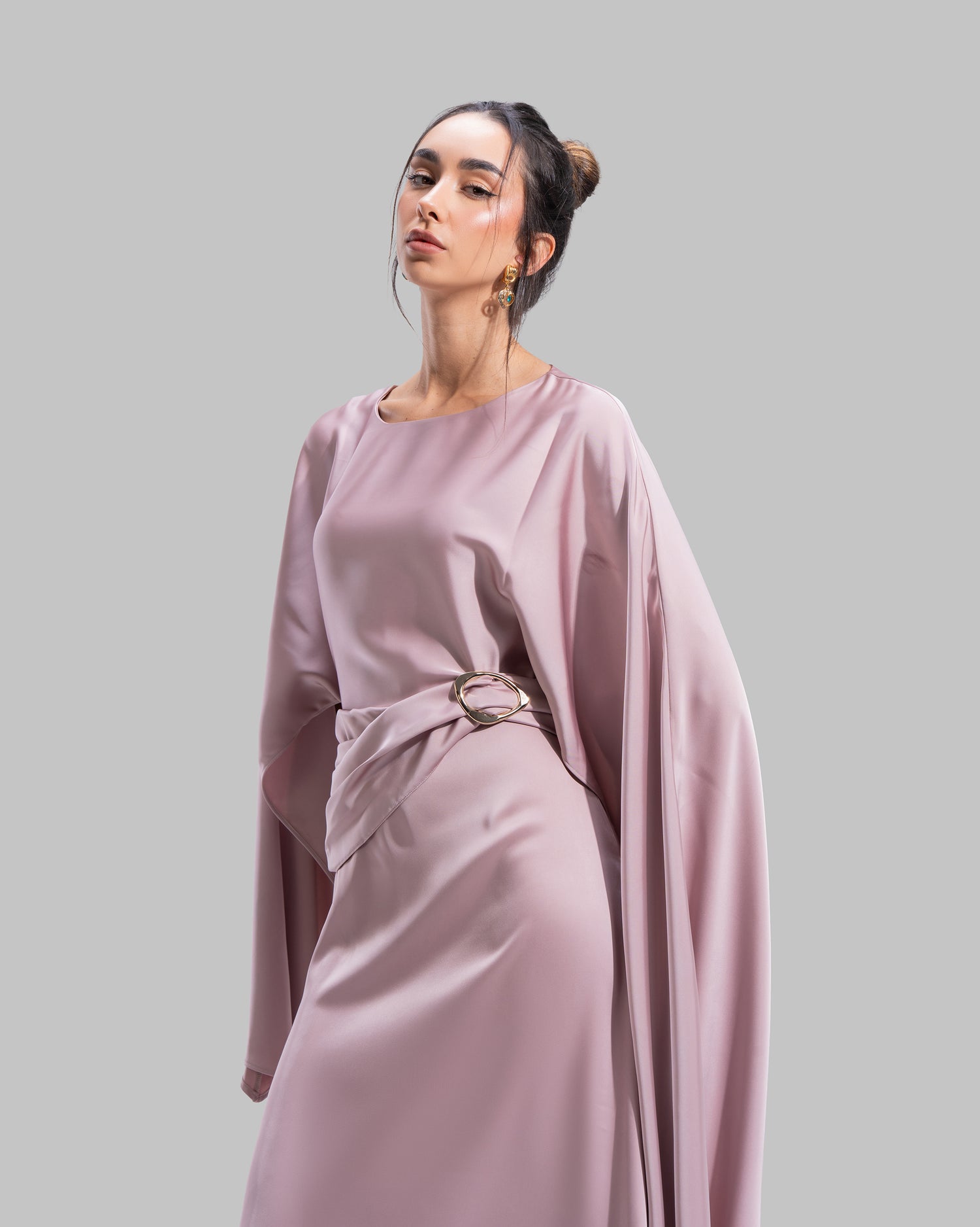 An elegant satin gown of sweeping length