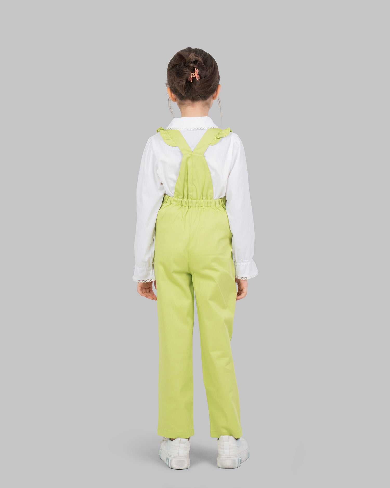 jumpsuit in flashy colors with adjustable shoulder straps and ruffle detailing.
