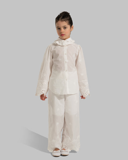 Button-up blouse with a ruffled collar and embroidered lace cuffs.