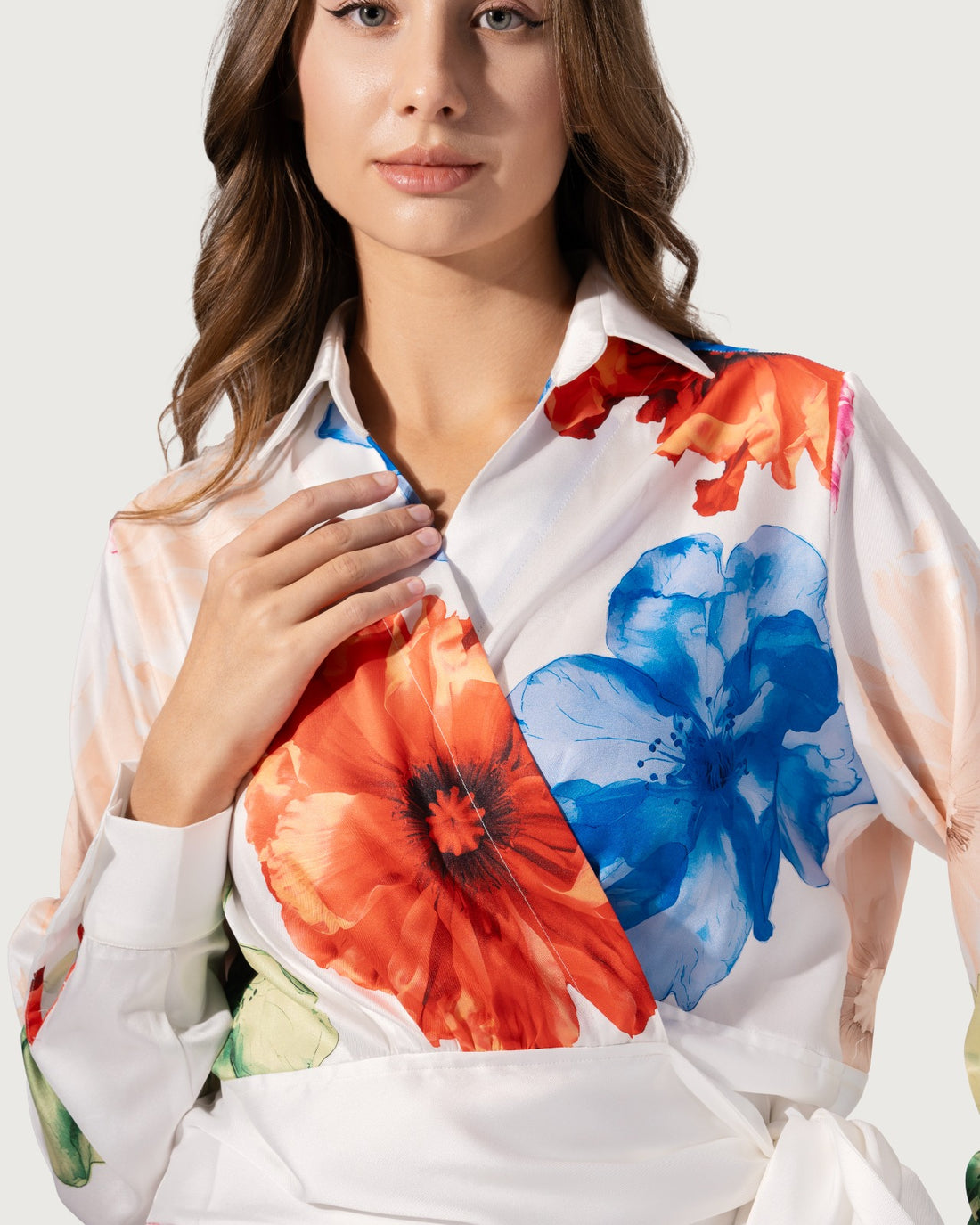 Wrap-effect blouse with a lapel collar and long sleeves.